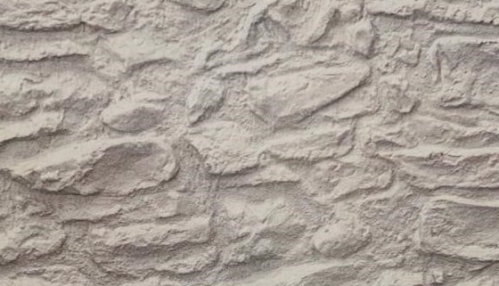close up of a wall with fibrous stone imitation