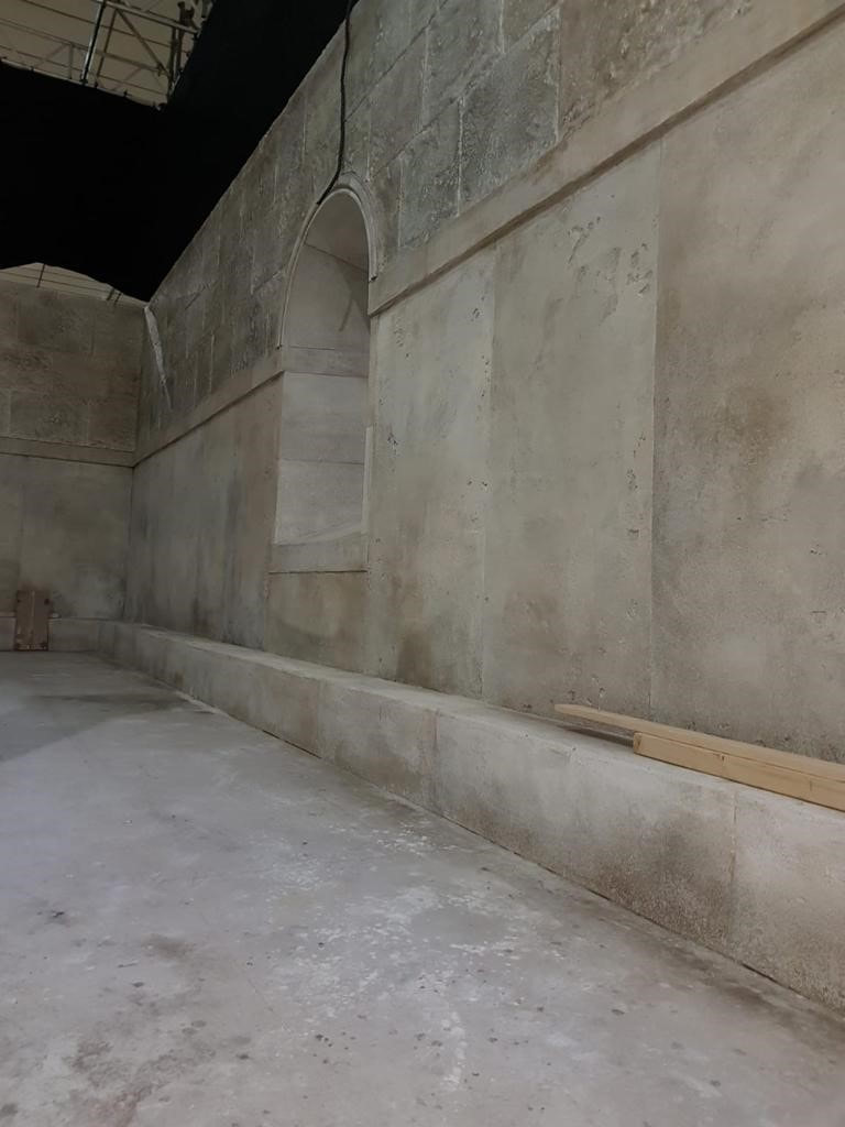 internal walls of a building that has a stone imitation finish