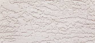 close up of a wall with a stucco finish